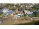 Aerial view of waterfront homes with private docks at 103 Shore Dr, Dunedin, FL 34698