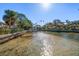 Stunning view of a peaceful canal with boats at 103 Shore Dr, Dunedin, FL 34698