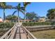 Wooden walkway to the home from the waterfront dock at 103 Shore Dr, Dunedin, FL 34698