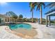 Inviting pool with spacious patio, pergola, and lush landscaping at 103 Shore Dr, Dunedin, FL 34698