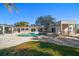 Home with a large pool and plenty of patio space at 103 Shore Dr, Dunedin, FL 34698