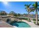 Spacious pool and patio area overlooking the water at 103 Shore Dr, Dunedin, FL 34698