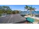 Private rooftop deck overlooking pool and waterfront at 103 Shore Dr, Dunedin, FL 34698