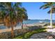 Expansive waterfront lot with private dock and lush landscaping at 103 Shore Dr, Dunedin, FL 34698