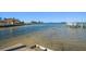 Scenic view of calm water with a dock and boats at 103 Shore Dr, Dunedin, FL 34698