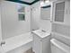 Clean bathroom with white fixtures and a shower/tub combo at 10510 114Th Ter, Largo, FL 33773