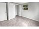 Bright bedroom with tile flooring and mirrored closet doors at 10510 114Th Ter, Largo, FL 33773