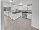 Modern kitchen with white cabinets and granite countertops at 10510 114Th Ter, Largo, FL 33773