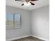 Well-lit bedroom with neutral walls and wood-look floors at 1502 Silktree Ct, Brandon, FL 33511