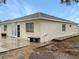 Rear view of the house showing patio and landscaping at 1502 Silktree Ct, Brandon, FL 33511