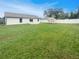 Spacious backyard with lush grass and a shed at 7224 Highland Loop, Zephyrhills, FL 33541