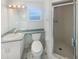 Clean bathroom with shower, toilet, and vanity at 7224 Highland Loop, Zephyrhills, FL 33541