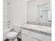 Simple bathroom with white vanity and bathtub at 6180 Pina Colada St, Zephyrhills, FL 33542