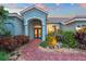 Welcoming entryway with double doors and a unique metal giraffe sculpture at 7419 Roxye Ln, Sarasota, FL 34240