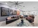 Spacious living area featuring comfortable seating, hardwood floors, and large-scale art at 7419 Roxye Ln, Sarasota, FL 34240