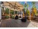 Relaxing patio with umbrella and comfortable wicker chairs at 7419 Roxye Ln, Sarasota, FL 34240