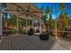 Screened patio with comfortable seating and a wooden deck at 7419 Roxye Ln, Sarasota, FL 34240