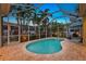 Relaxing kidney-shaped pool with screened enclosure at 7419 Roxye Ln, Sarasota, FL 34240