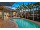 Inviting kidney shaped pool with a screened patio at 7419 Roxye Ln, Sarasota, FL 34240