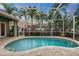 Enclosed kidney shaped pool with a tranquil ambiance at 7419 Roxye Ln, Sarasota, FL 34240