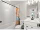 Clean bathroom with white vanity, bathtub, and shower at 2546 Buckthorn Loop, North Port, FL 34289