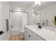 Modern bathroom with white cabinets and a bathtub at 2546 Buckthorn Loop, North Port, FL 34289