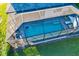 Aerial view of a refreshing screened pool with paved patio at 2546 Buckthorn Loop, North Port, FL 34289