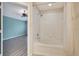 Bathroom with tub, shower, and wood flooring at 1006 Vista Cay Ct, Brandon, FL 33511