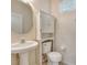 Small bathroom with pedestal sink and linen cabinet at 1006 Vista Cay Ct, Brandon, FL 33511