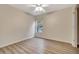 Bright bedroom with wood-look floors and ceiling fan at 1006 Vista Cay Ct, Brandon, FL 33511