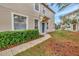 Townhome entrance with teal door and green shrubs at 1006 Vista Cay Ct, Brandon, FL 33511