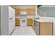 Galley kitchen with wood cabinets and stainless steel appliances at 1006 Vista Cay Ct, Brandon, FL 33511