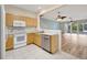 Galley kitchen with wood cabinets and stainless steel appliances at 1006 Vista Cay Ct, Brandon, FL 33511