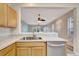 Kitchen view of living area with wood flooring at 1006 Vista Cay Ct, Brandon, FL 33511
