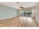 Living room boasts wood-look floors and a ceiling fan at 1006 Vista Cay Ct, Brandon, FL 33511