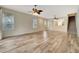 Spacious living room with wood-look floors and multiple windows at 1006 Vista Cay Ct, Brandon, FL 33511