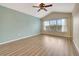 Main bedroom with vaulted ceiling, wood floors and window at 1006 Vista Cay Ct, Brandon, FL 33511