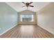 Main bedroom with vaulted ceiling, wood floors and window at 1006 Vista Cay Ct, Brandon, FL 33511
