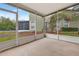 Spacious screened porch with view of backyard at 1006 Vista Cay Ct, Brandon, FL 33511