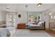 Bedroom with French doors leading to the backyard, and a chaise lounge at 3000 21St S Ave, St Petersburg, FL 33712