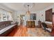 Elegant dining room with hardwood floors, antique furniture, and a view to the kitchen at 3000 21St S Ave, St Petersburg, FL 33712
