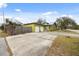 Green house exterior with two-car garage and a spacious yard at 3000 21St S Ave, St Petersburg, FL 33712