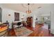 Home office with hardwood floors, antique furniture, and a view to the living room at 3000 21St S Ave, St Petersburg, FL 33712