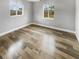 Spacious bedroom with hardwood floors and dual windows at 5466 9Th N Ave, St Petersburg, FL 33710