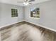 Bright bedroom with hardwood floors and neutral walls at 5466 9Th N Ave, St Petersburg, FL 33710