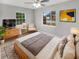 Spacious bedroom with large windows, hardwood floors, and a light and airy feel at 5466 9Th N Ave, St Petersburg, FL 33710