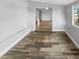 Open dining room with hardwood floors and access to kitchen at 5466 9Th N Ave, St Petersburg, FL 33710