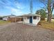 Updated home exterior with a covered carport and landscaped yard at 5466 9Th N Ave, St Petersburg, FL 33710