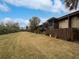 Spacious backyard with grassy lawn and wooden fence at 705 S Village N Dr # 205, St Petersburg, FL 33716