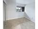 Spacious bedroom with mirrored closet and tile floors at 705 S Village N Dr # 205, St Petersburg, FL 33716